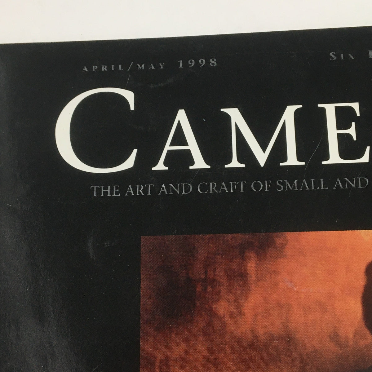 Close-up detail of the Camera Arts Magazine April 1998 title, emphasizing art and photography craftsmanship.