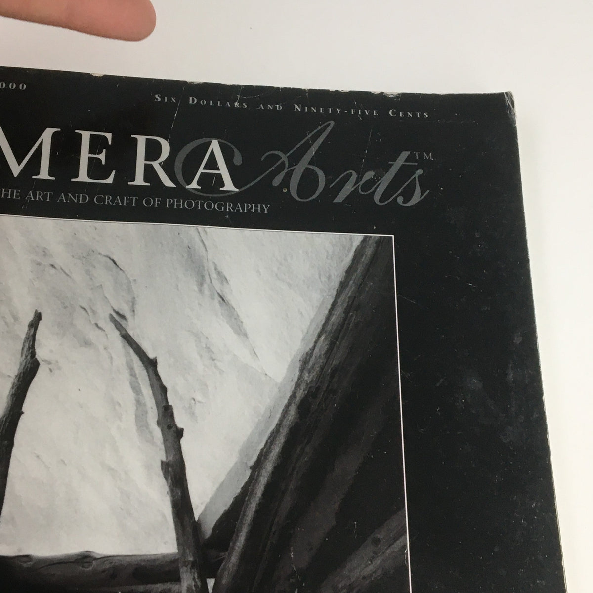 Close-up of the Camera Arts Magazine October 2000 logo and detail, featuring a photograph of kiva leader poles by John Sexton.