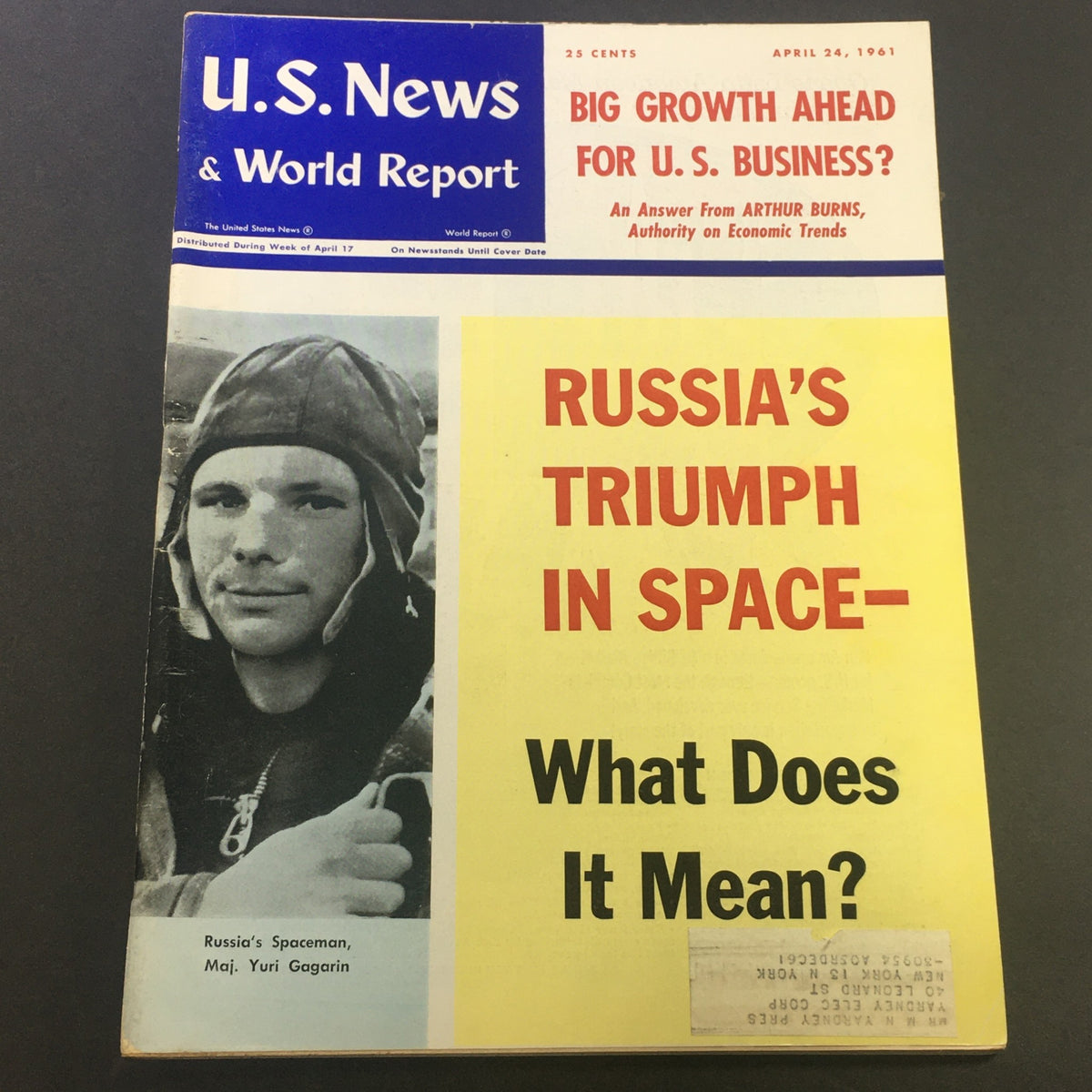 Cover of the vintage U.S. News & World Report magazine from April 24, 1961, featuring the bold headline 'Russia's Triumph in Space' along with imagery related to the space race, highlighting the historical context of the Cold War era.