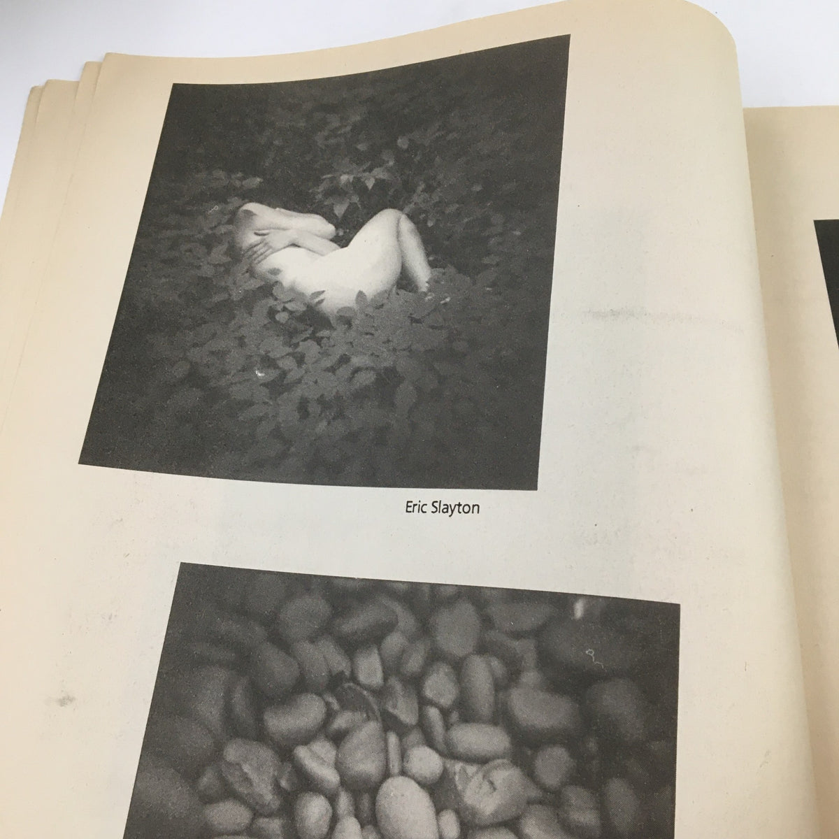 Another page from Inside Shots Magazine 2000 #68 featuring photographic art by Eric Slayton, including an abstract image of a reclining figure and pebbles.