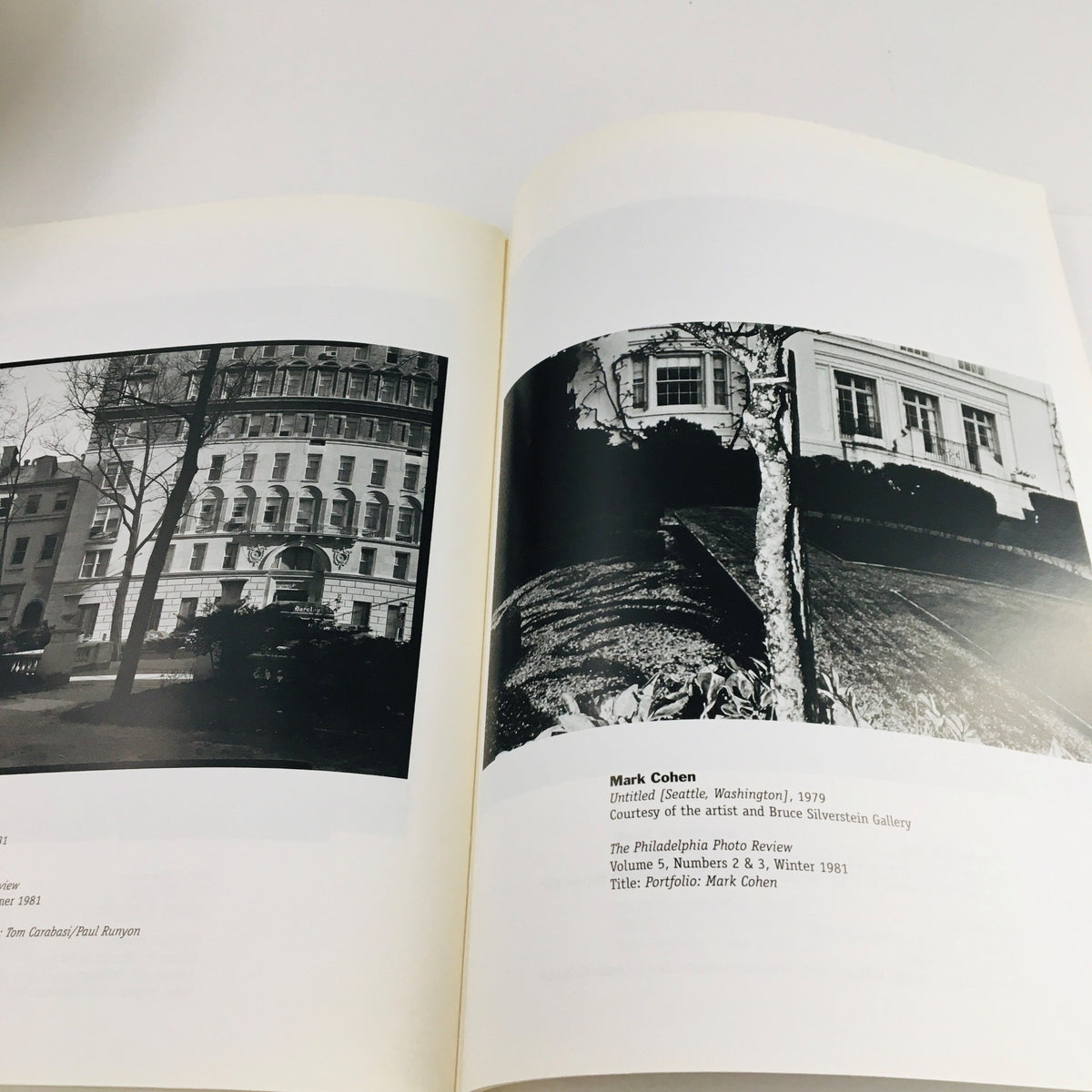Interior pages of 'Re-Viewing Photography' March 2002 magazine, featuring black-and-white photographs and a detailed artist portfolio of Mark Cohen.