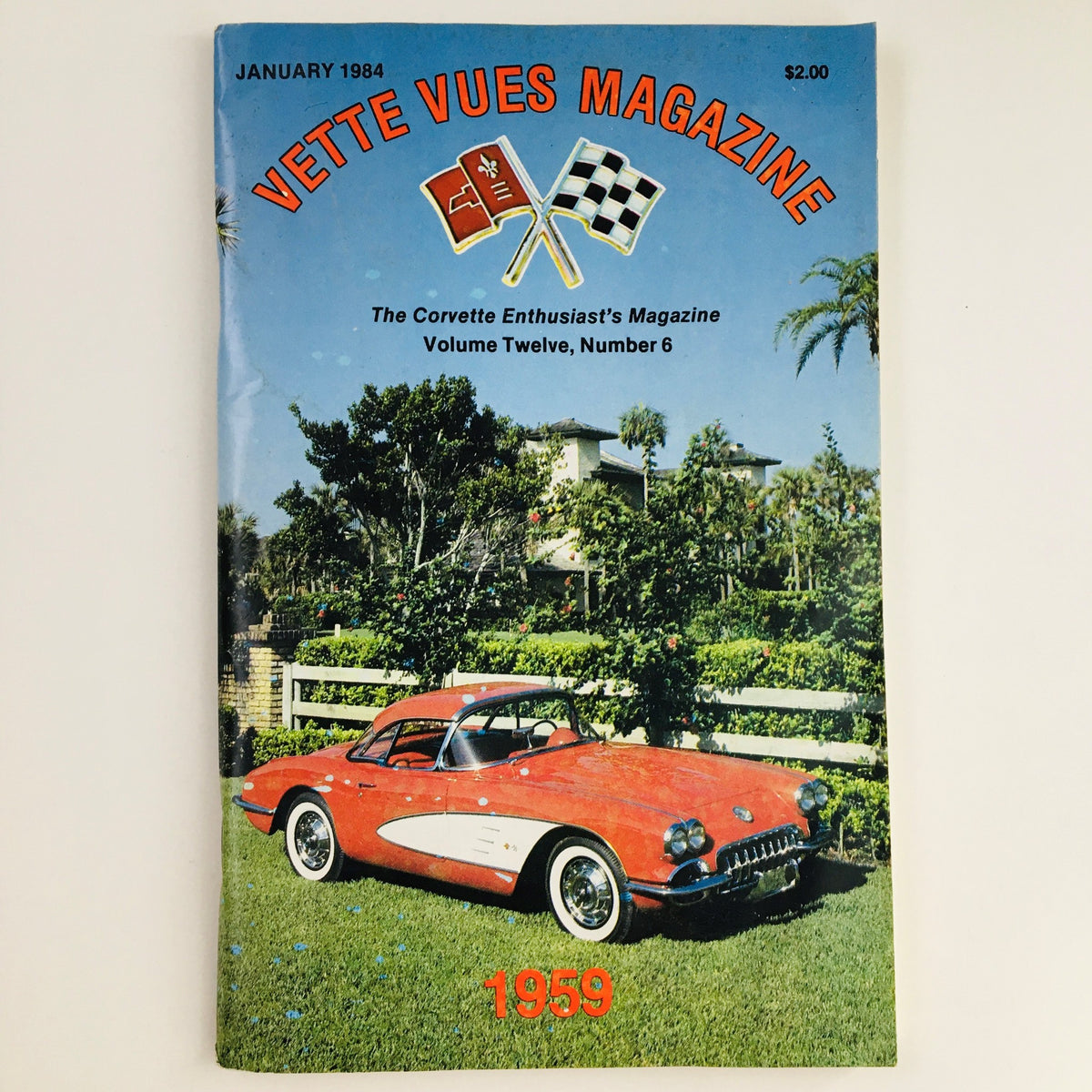 Cover of Vette Vues Magazine January 1984 Vol 12 #6 featuring a classic 1959 Corvette parked on lush green grass. Ideal for Corvette enthusiasts and collectors.