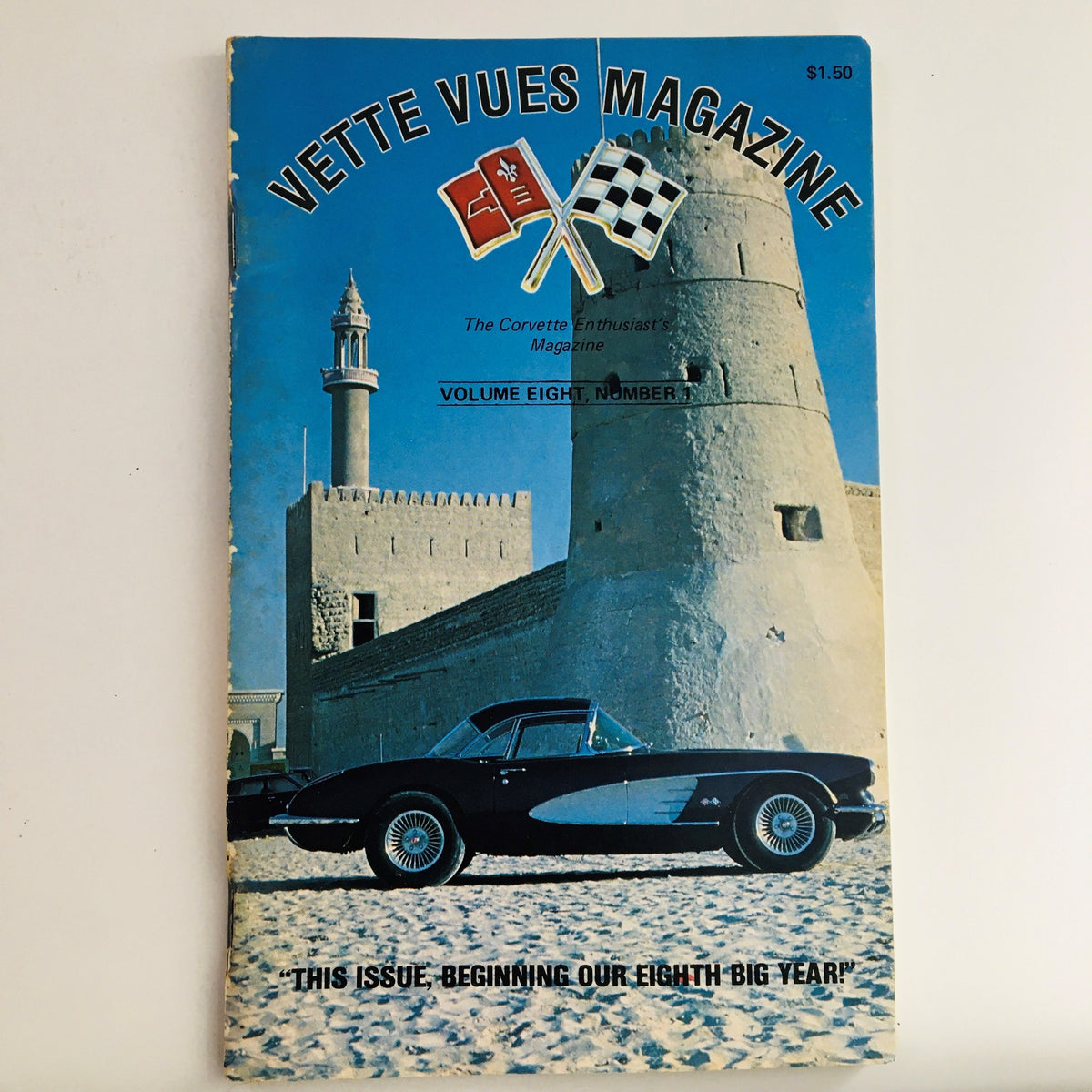 Cover of Vette Vues Magazine Vol 8 #1 featuring a classic 1958 Corvette parked in front of an ancient structure in Dubai, U.A.E., emphasizing vintage automotive culture.