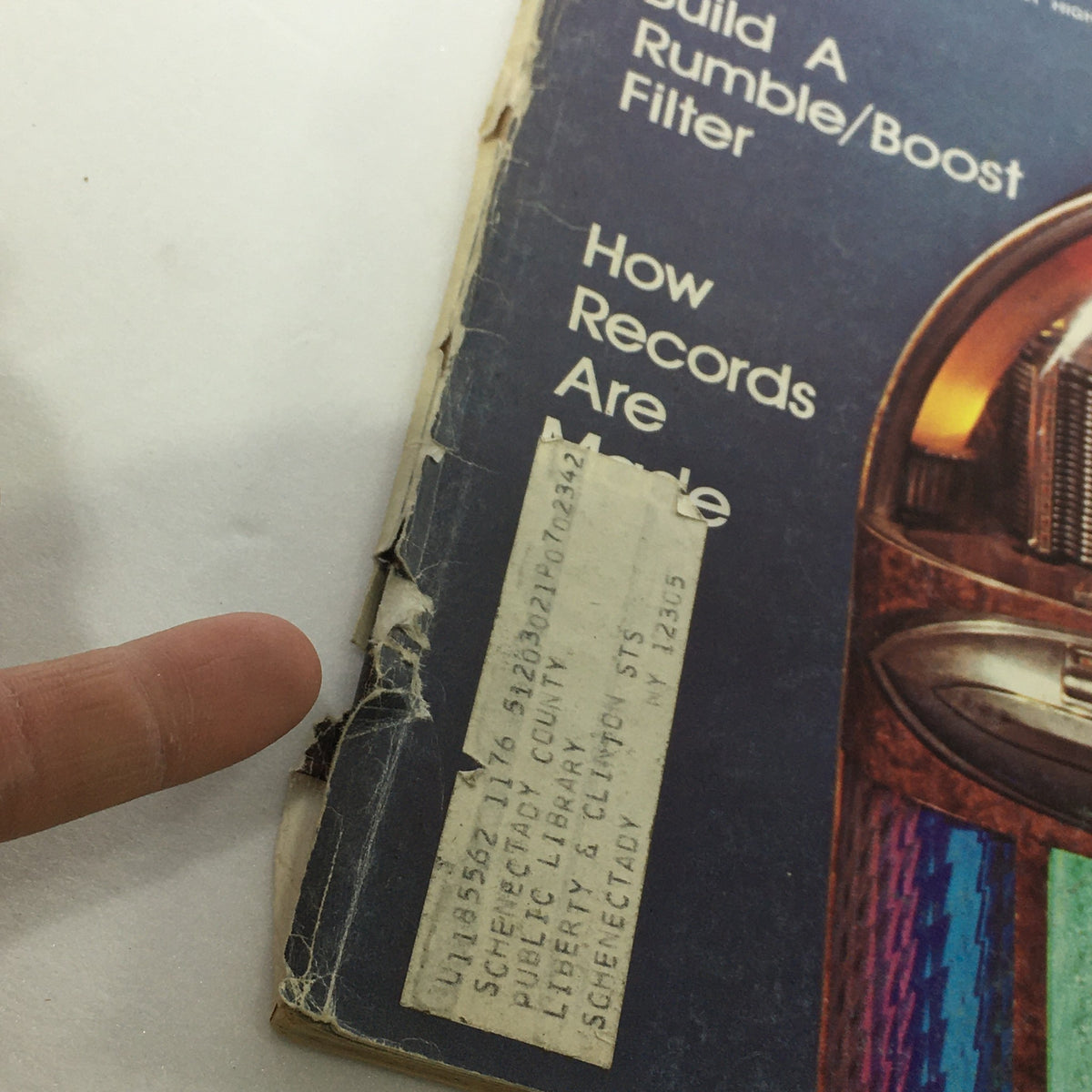 Close-up of the spine of the June 1976 VTG Audio and Music Magazine with a library label and signs of wear.