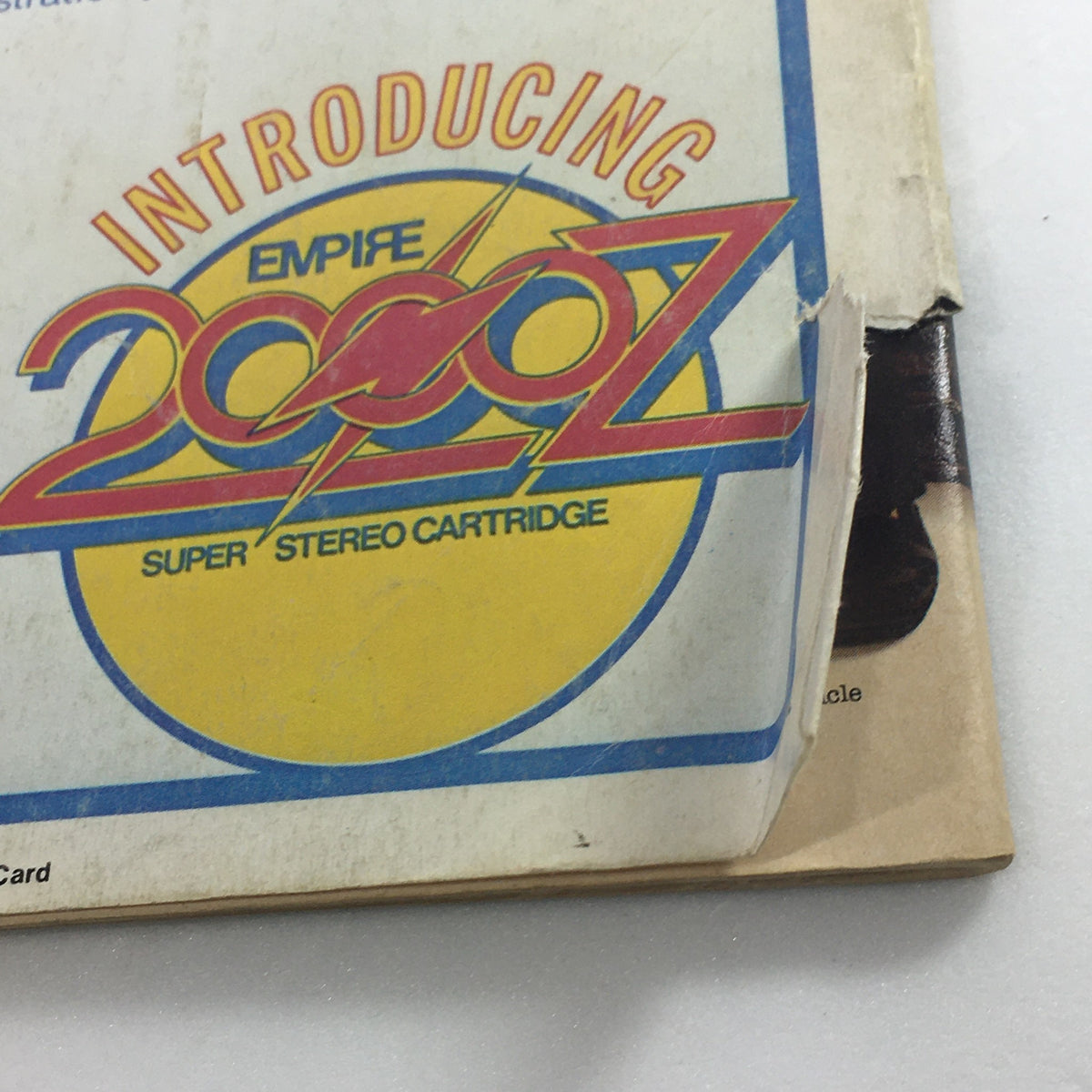 Close-up of the Empire 2000Z super stereo cartridge logo on the back cover of VTG Audio and Music Magazine June 1976, highlighting its features.