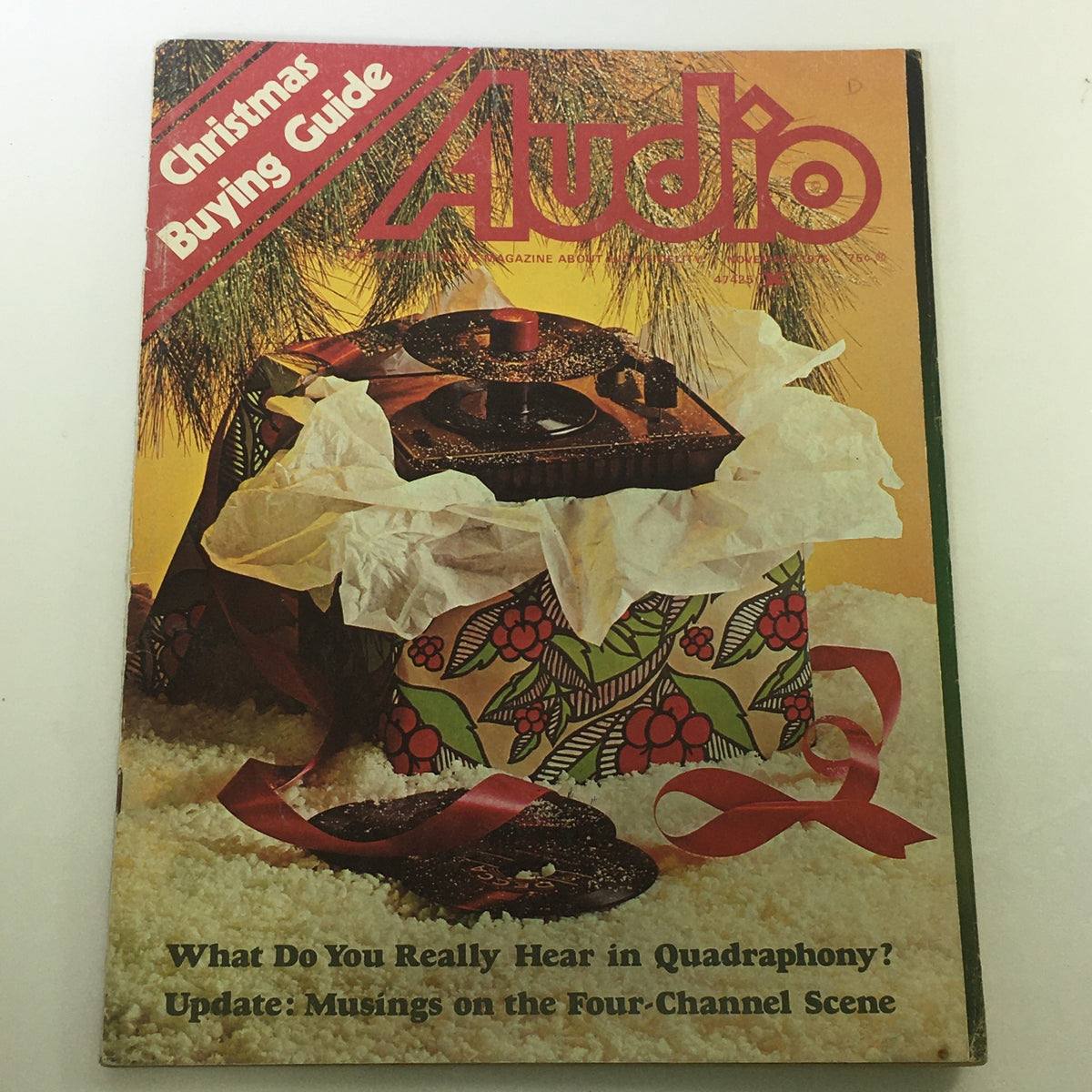 Cover of VTG Audio and Music Magazine November 1975 featuring a Christmas Buying Guide with a vintage turntable wrapped in festive paper, showcasing music and audio equipment insights from the 1970s.