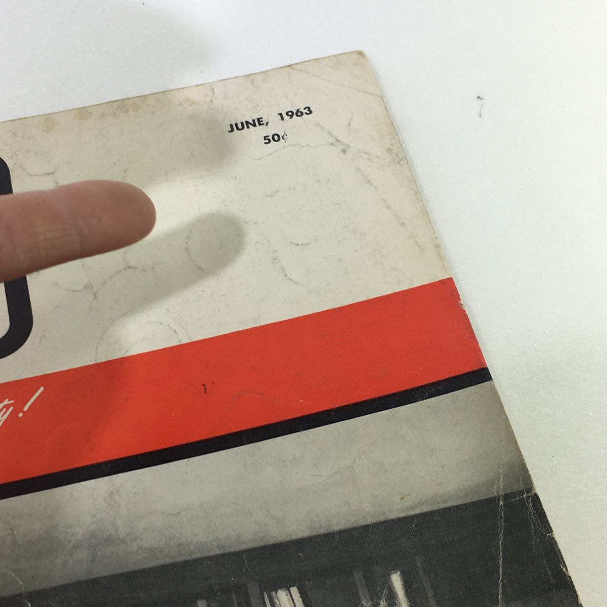 Detailed view of the top corner of the VTG Audio and Music Magazine June 1963, showing the publication date and price, emphasizing its historical significance.