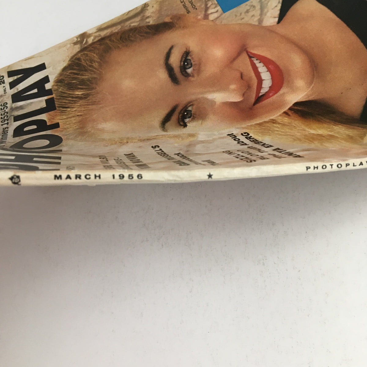 Side view of Photoplay Magazine March 1956, highlighting the title and vintage graphics. A collectible issue reflecting classic Hollywood.