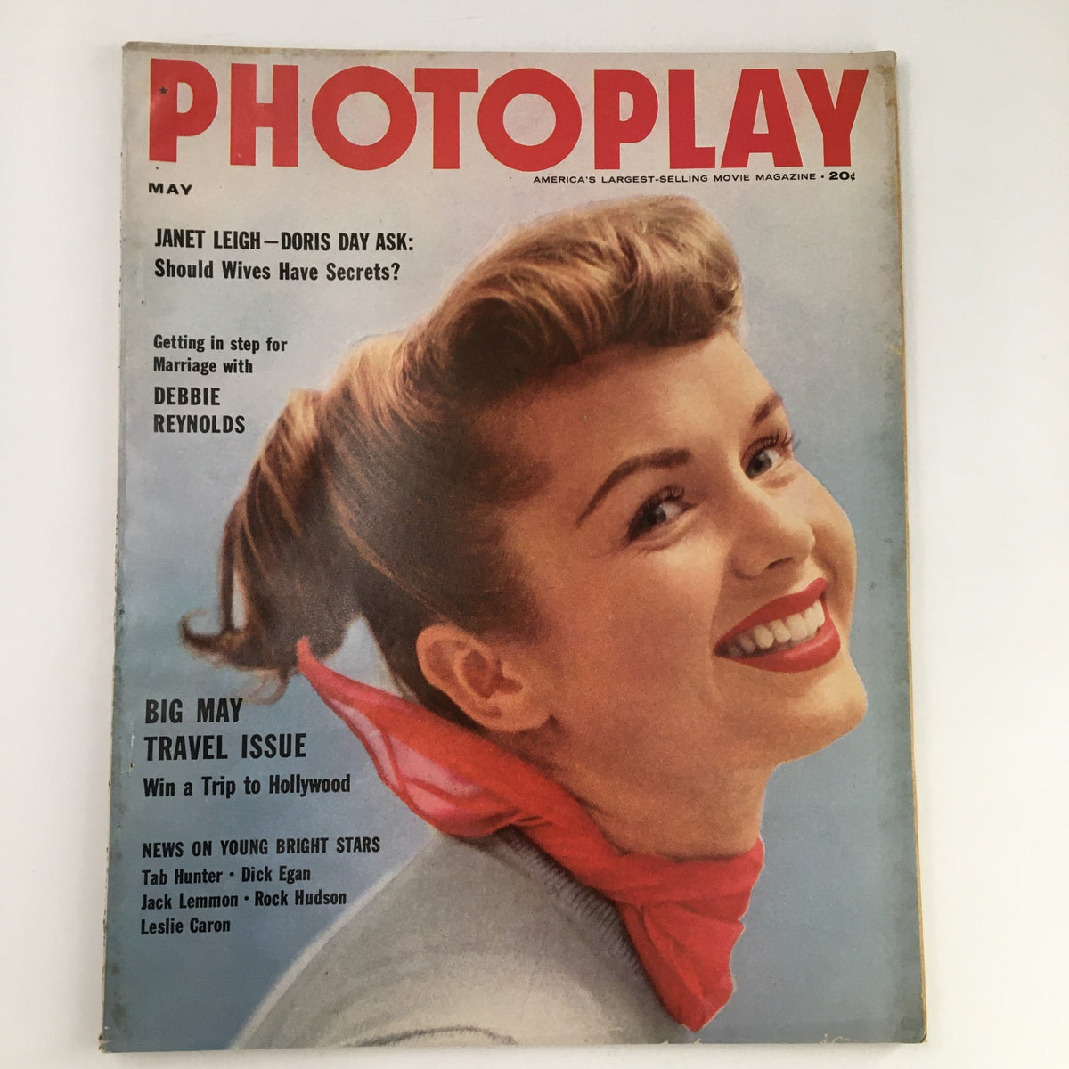 Cover of Photoplay Magazine May 1955 featuring a smiling woman with a red scarf, highlighting articles about Janet Leigh, Doris Day, and Debbie Reynolds.