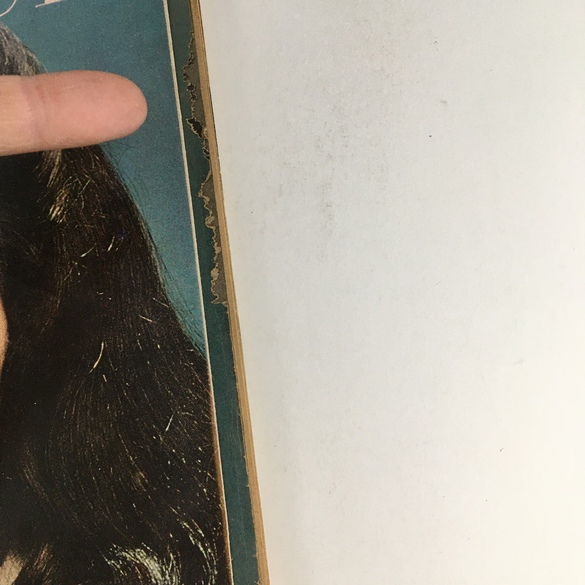 Close-up view of the side of the Glamour Magazine November 1966 cover, highlighting the texture and minor wear on the edge. The magazine features Richard Burton and Jake's Quiz.
