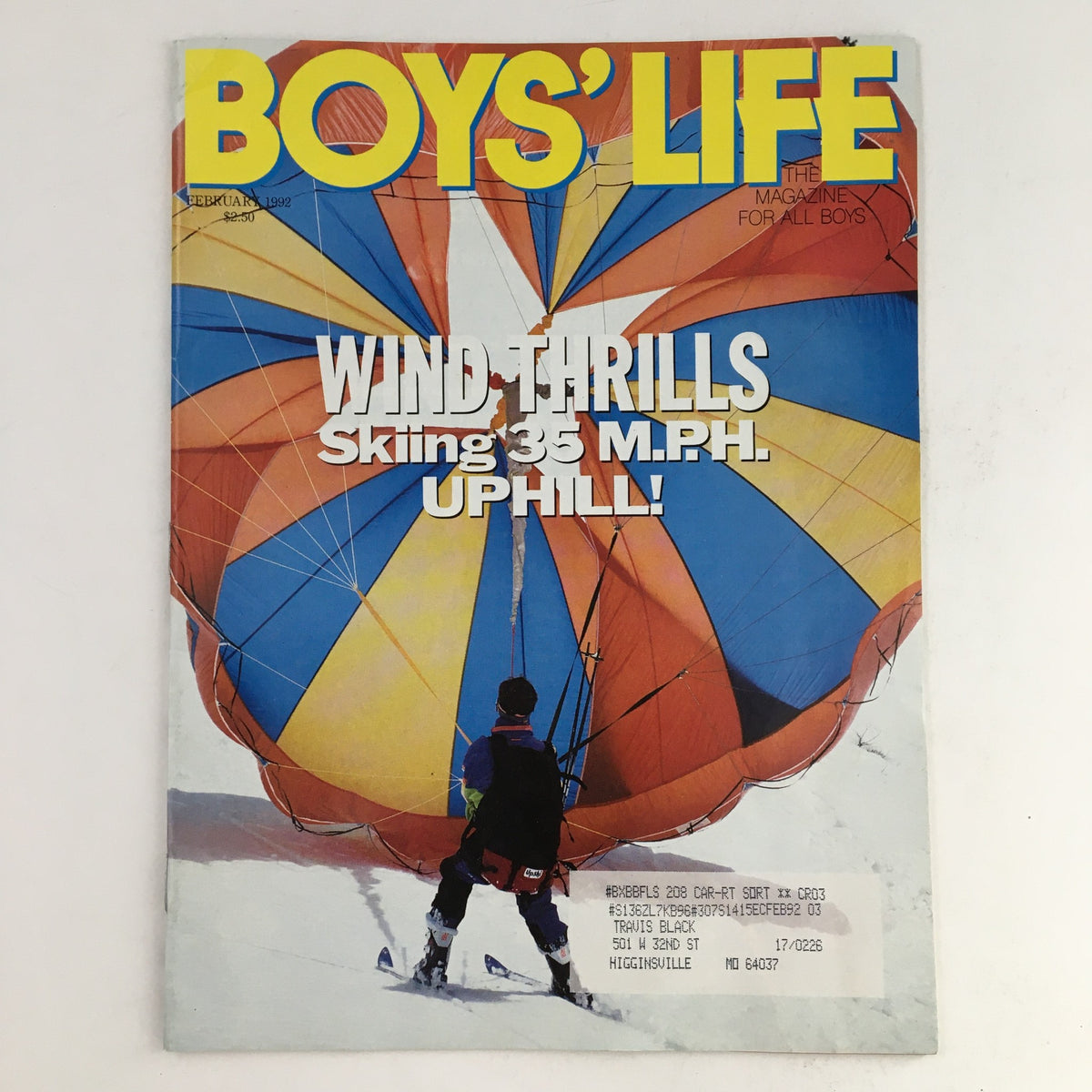 Boys' Life Magazine February 1992 featuring the cover story 'Wind Thrills Skiing 35 M.P.H. Uphill' with a colorful parachute and skier in winter setting.