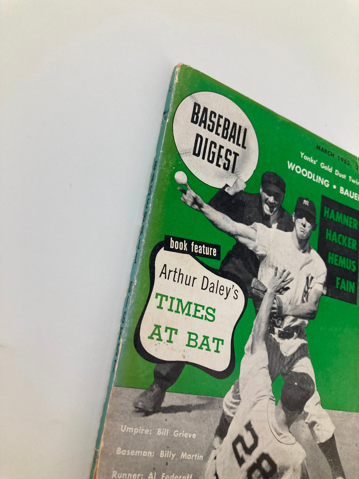 Detailed shot of the Vintage Baseball Digest March 1953 cover showcasing players and umpire, emphasizing the play of the game.