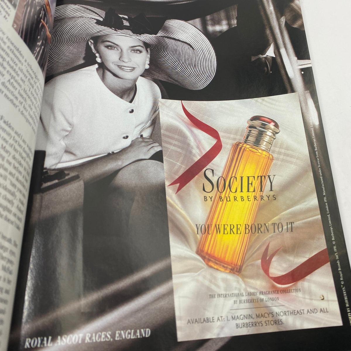 Magazine page from Vogue June 1991 featuring an advertisement for Burberry's Society fragrance, paired with vintage fashion imagery.