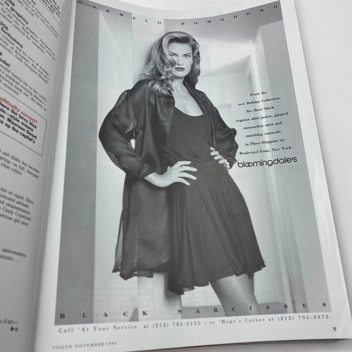 Vogue Magazine November 1991, advertisement featuring a model in a black outfit, illustrating classic 90s fashion style.