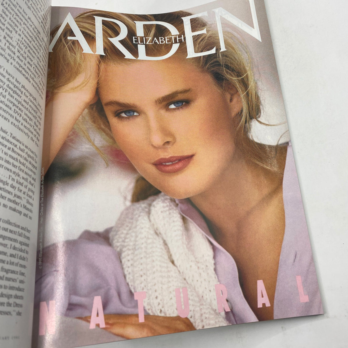 Vogue Magazine January 1991 featuring a beauty editorial with model Elizabeth Arden showcasing a natural look with soft makeup and a cozy, light-colored sweater.