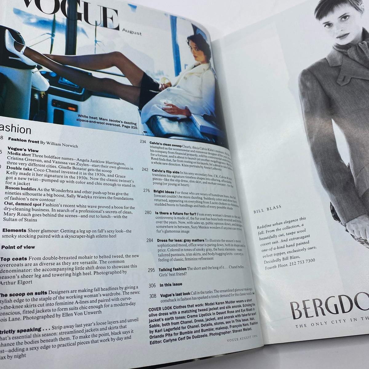 Inside spread of Vogue Magazine August 1994, showcasing editorial content on fashion, including a high-fashion image and various articles that reflect style trends of the time.