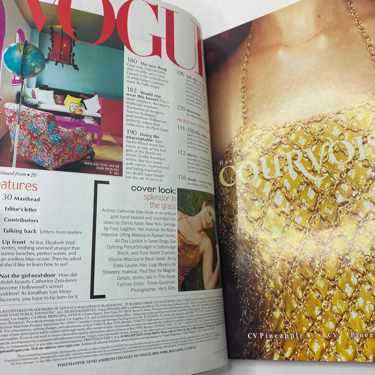 Interior pages of Vogue Magazine July 2001, highlighting vibrant fashion features and editor's letters.