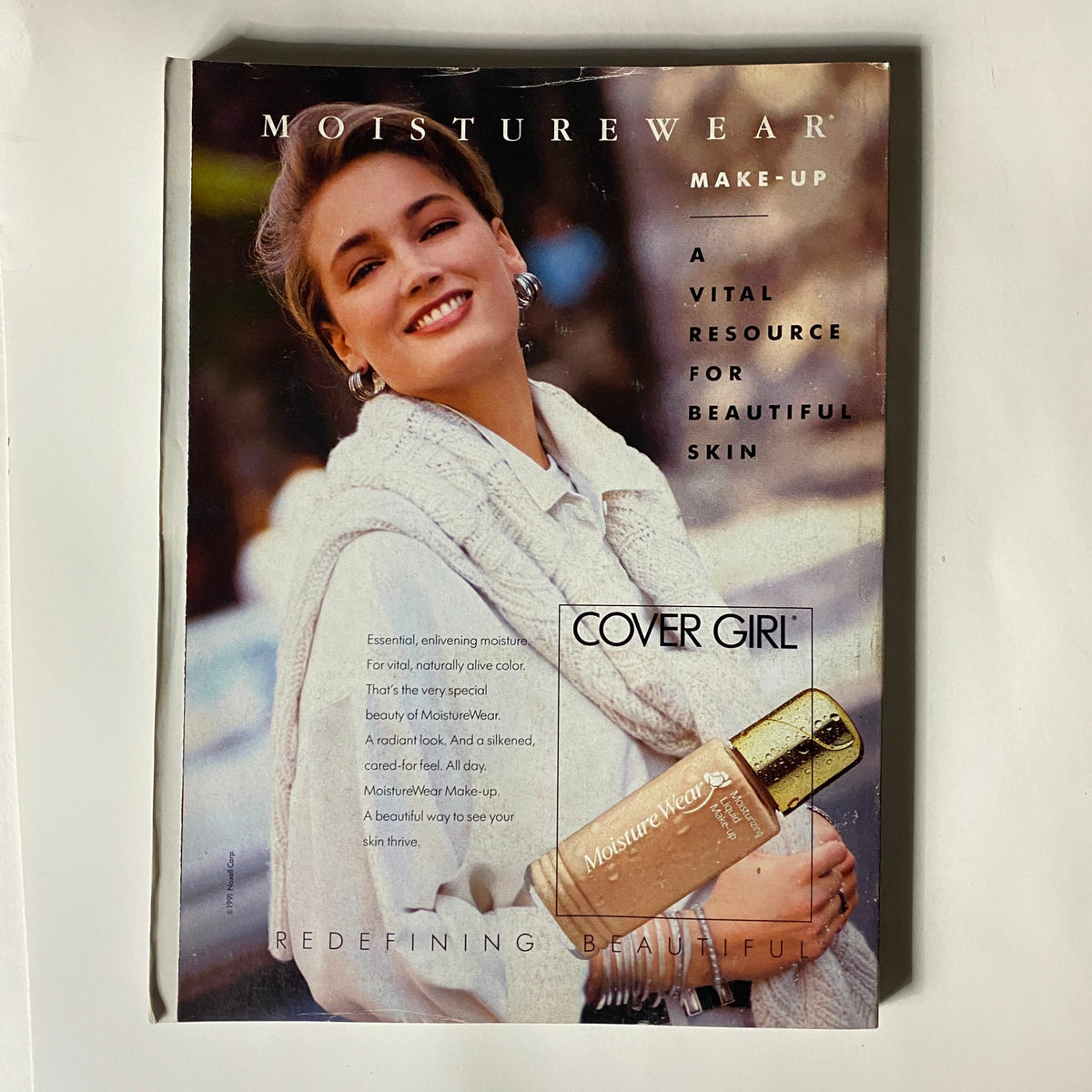 Cover Girl MoistureWear advertisement from Vogue Magazine April 1991 showcasing a model promoting skincare and cosmetics.