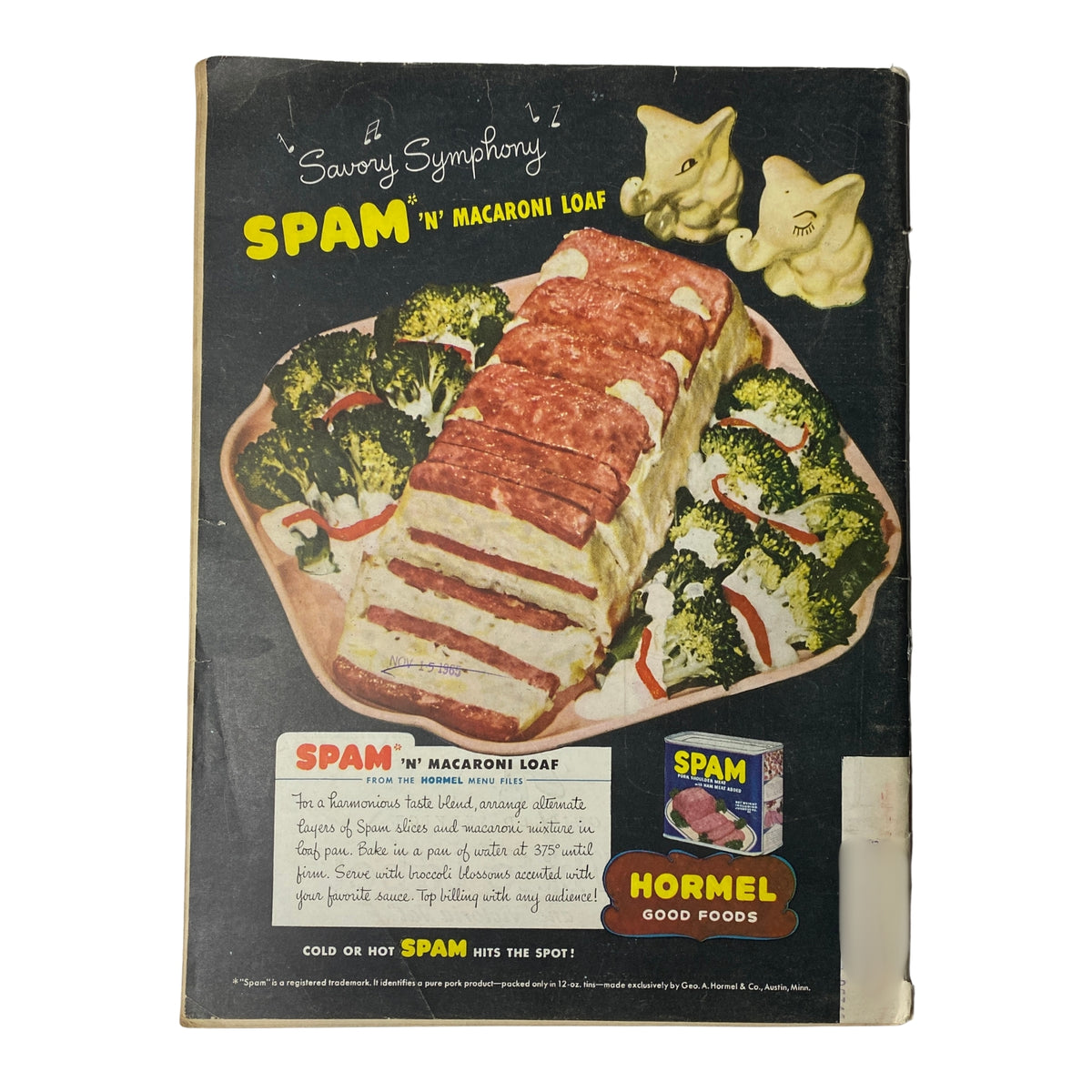 Back cover of a cookbook featuring the recipe for SPAM 'n' Macaroni Loaf, with a colorful presentation of the dish alongside broccoli and decorative elephant figurines.