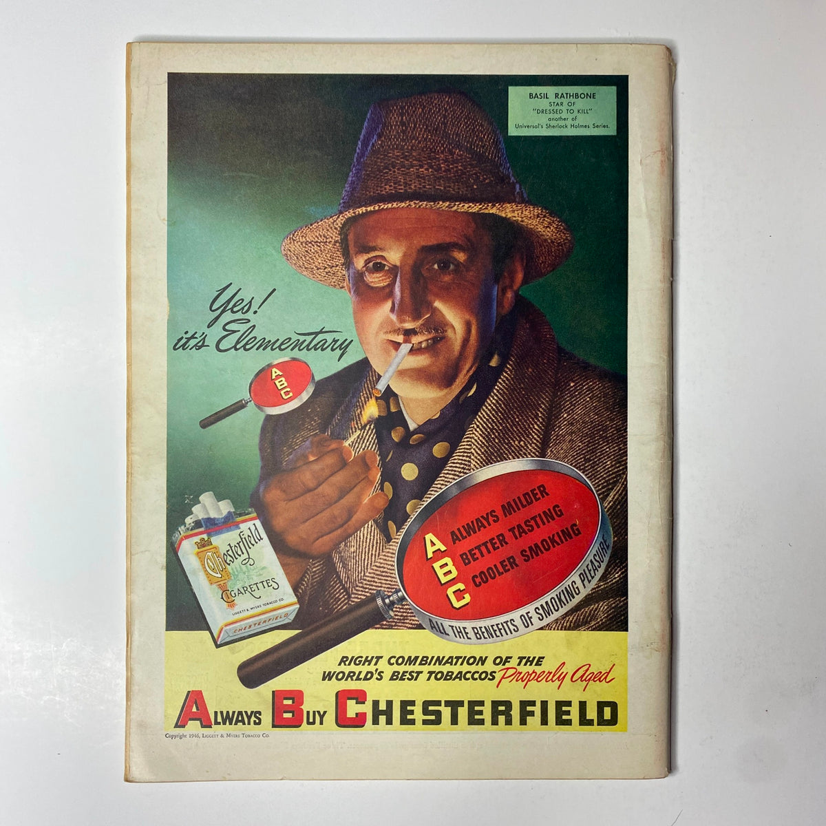 Vintage advertisement for Chesterfield cigarettes featuring an actor smoking, promoting their quality and flavor, highlighted by the tagline 'Yes! it's Elementary'.