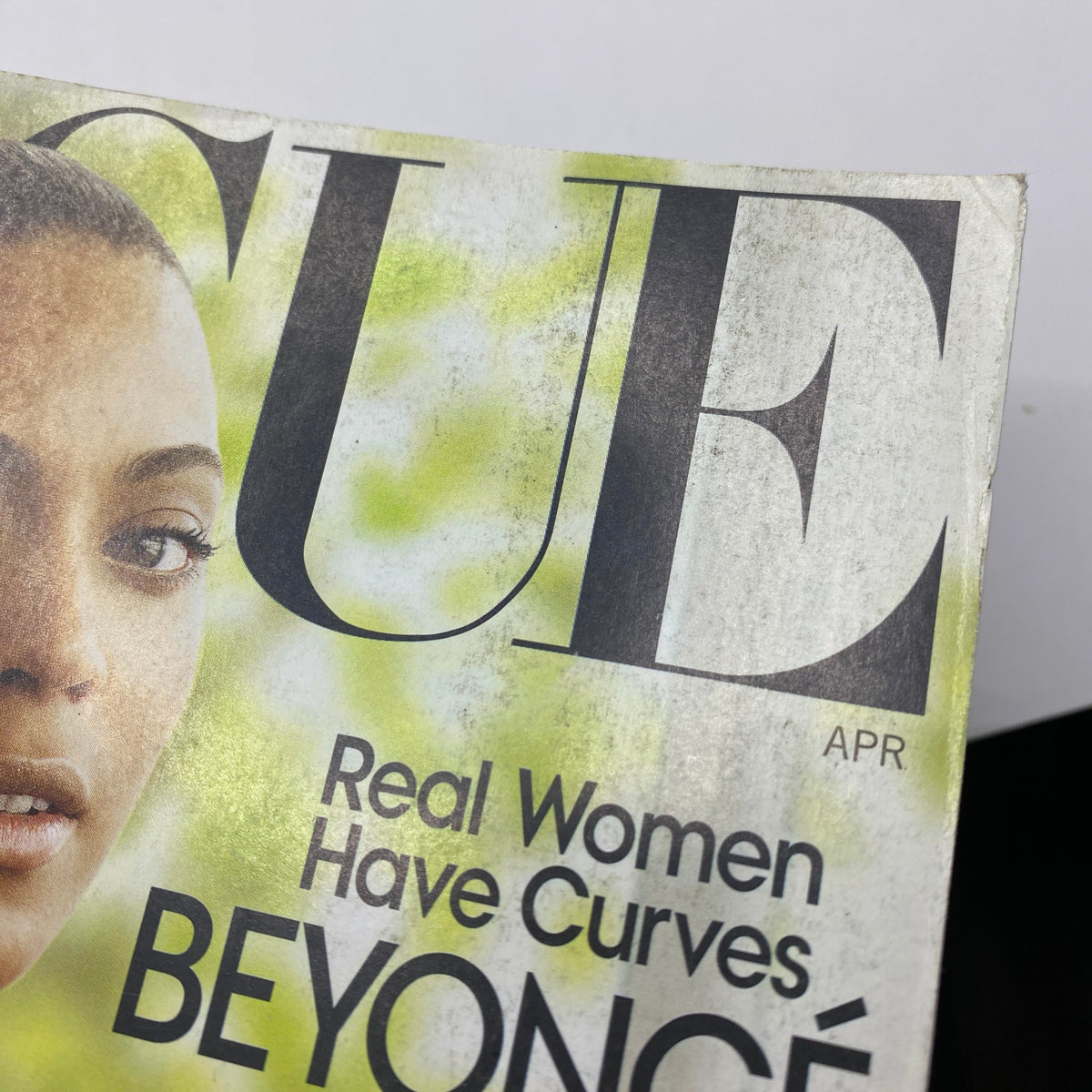 Close-up of Vogue Magazine April 2009 cover with Beyoncé Knowles. Emphasizes the headline 'Real Women Have Curves' and the magazine's connection to empowering fashion narratives.
