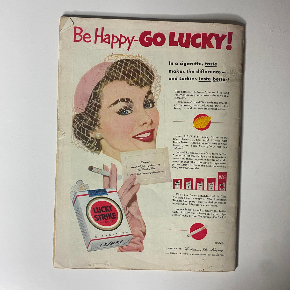 Vintage advertisement for Lucky Strike cigarettes from the back cover of Time Magazine June 30, 1952, featuring a woman promoting the brand with a pack of cigarettes.