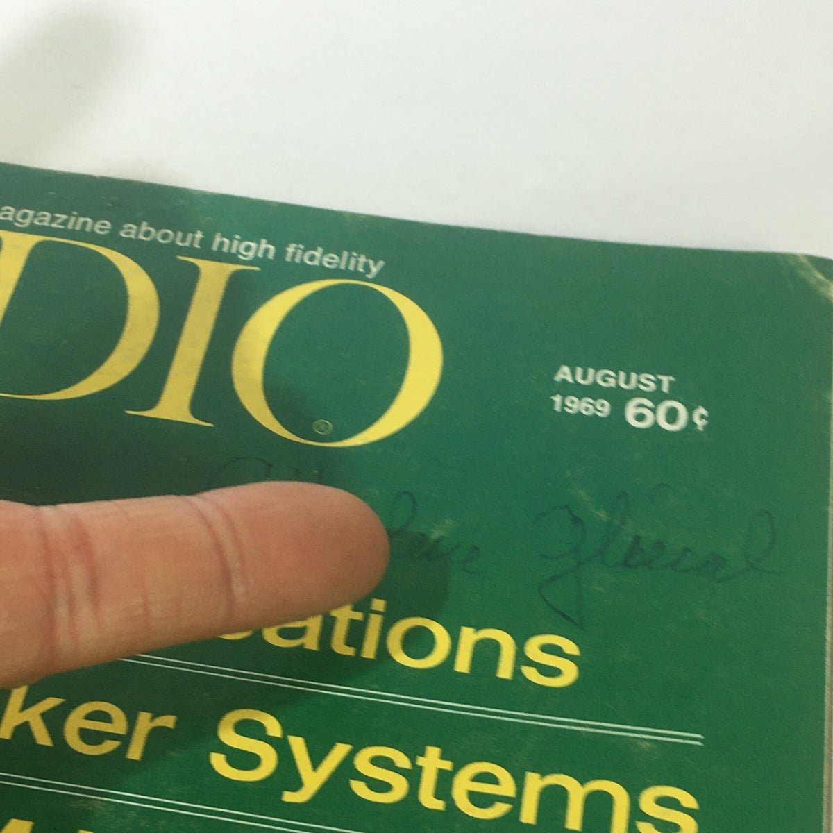 Close-up of the August 1969 Audio & Music Magazine cover, highlighting the title and a handwritten signature.