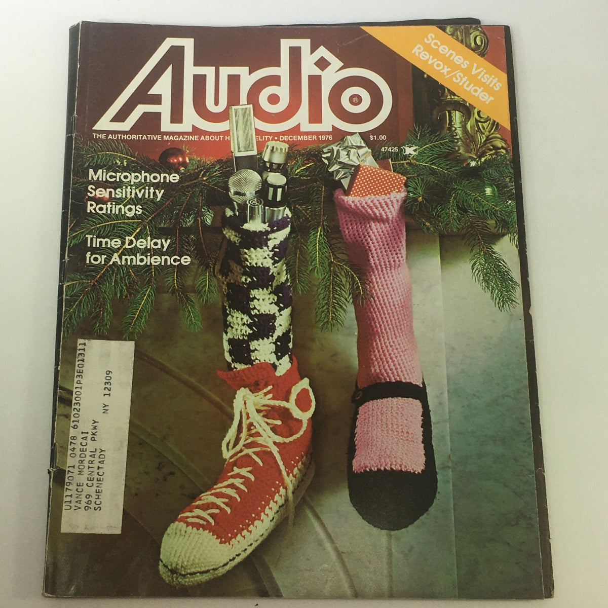 Vintage December 1976 issue of Audio & Music Magazine featuring a festive cover with microphone sensitivity ratings and whimsical knitted stockings. Ideal collectible for music technology enthusiasts.