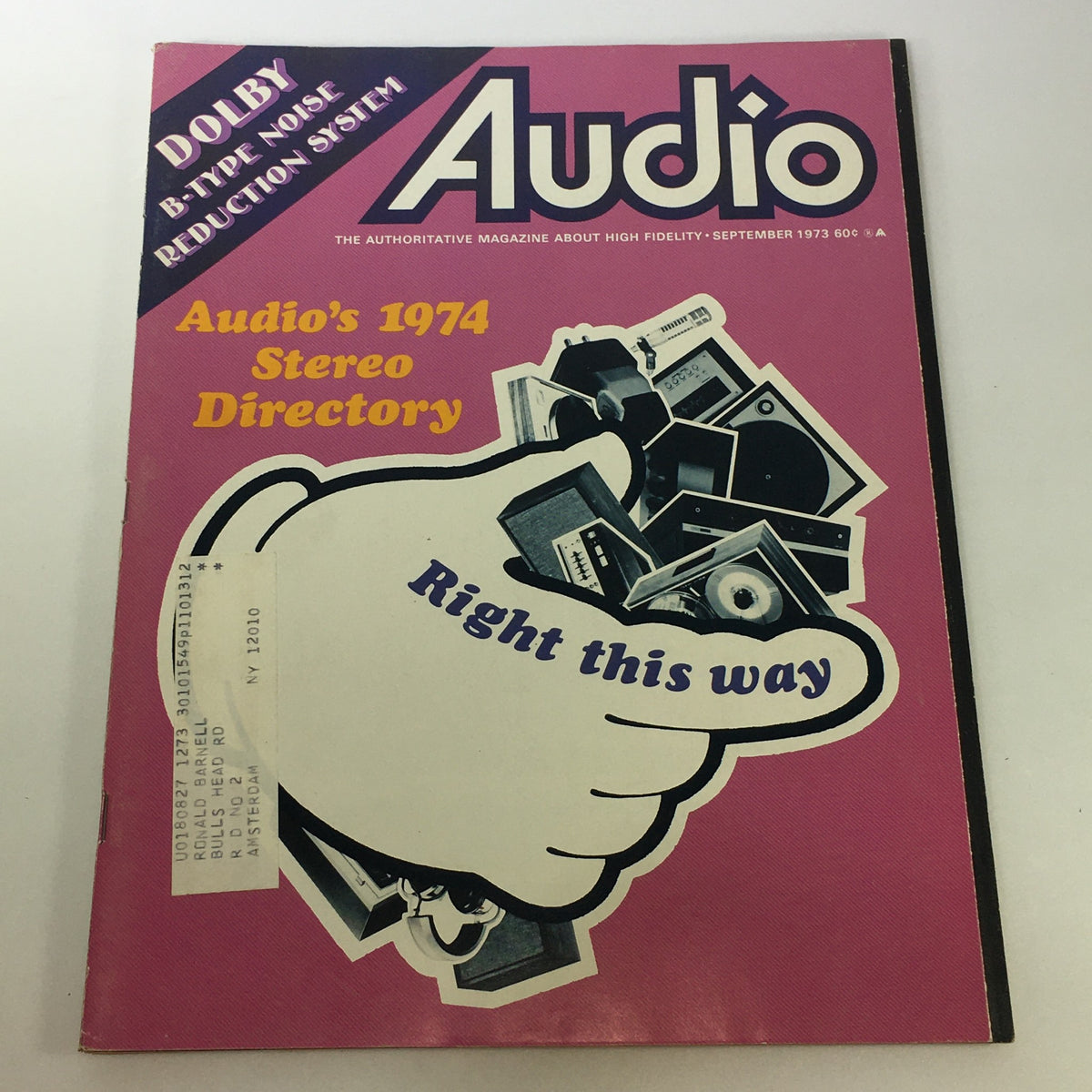 Cover of VTG Audio & Music Magazine September 1973 featuring Audio's 1974 Directory. The vibrant pink background features an illustration of a hand pointing with audio equipment depicted, showcasing the theme of audio technology of the era.