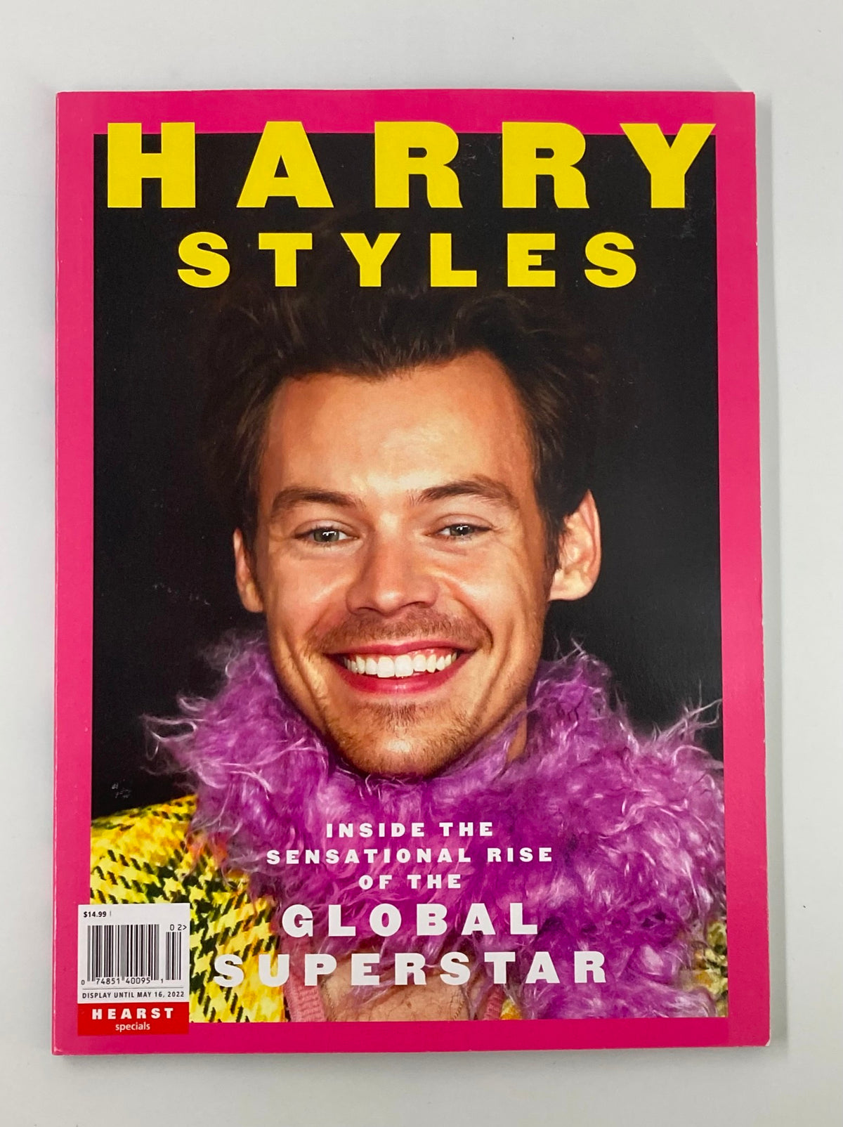 Cover of Hearst Magazine May 2022 featuring Harry Styles with a joyful smile, showcasing his sensational rise as a global superstar.