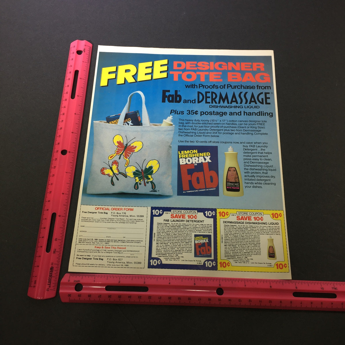 VTG 1980 Fab & Dermassage Dish-washing Liquid advertisement highlighting a free designer tote bag, featuring a close-up view of the ad and product details, with measurement reference.