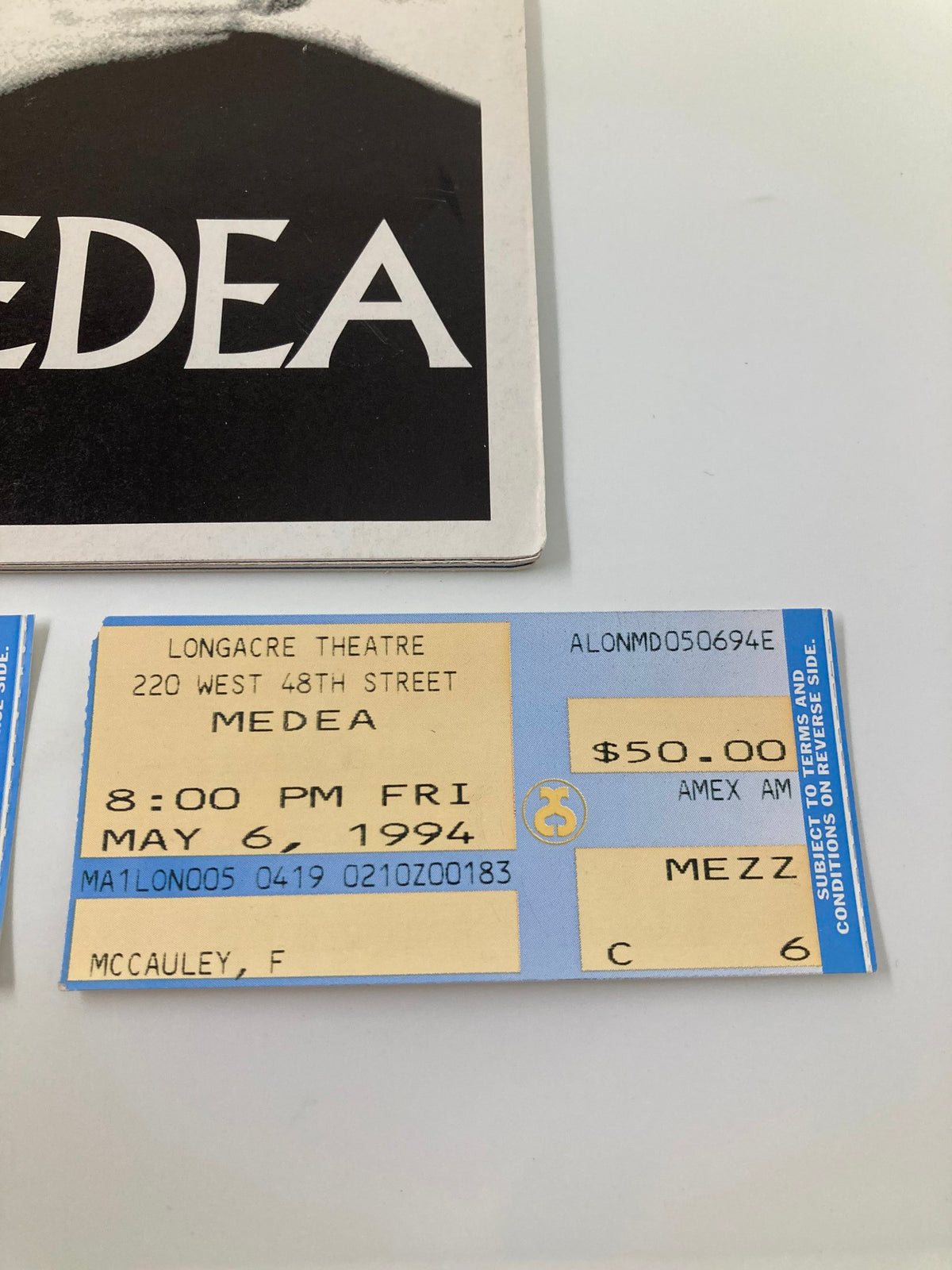 Detailed view of a ticket from the Longacre Theatre's 1994 production of Medea, with performance information for May 6, 1994.