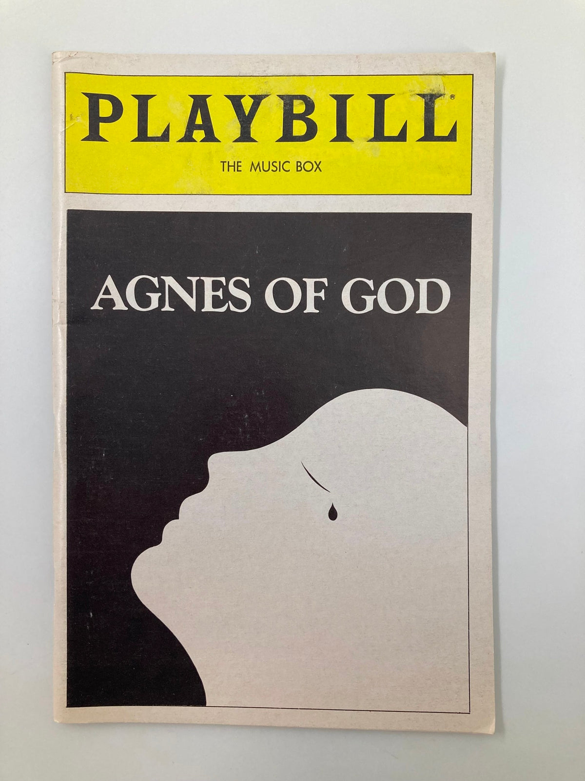 1982 Playbill for The Music Box production of Agnes of God featuring a minimalist design with a silhouette profile.