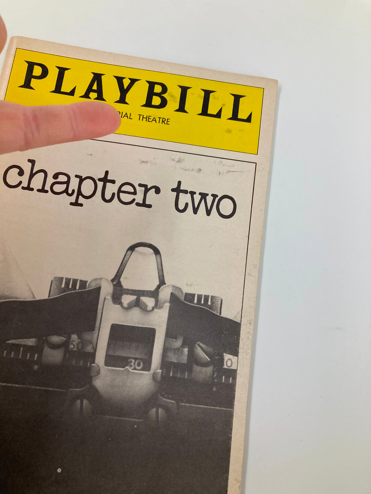 Close-up of the 1978 Playbill Imperial Theatre Chapter Two, highlighting the cover with the title and a finger pointing to it.
