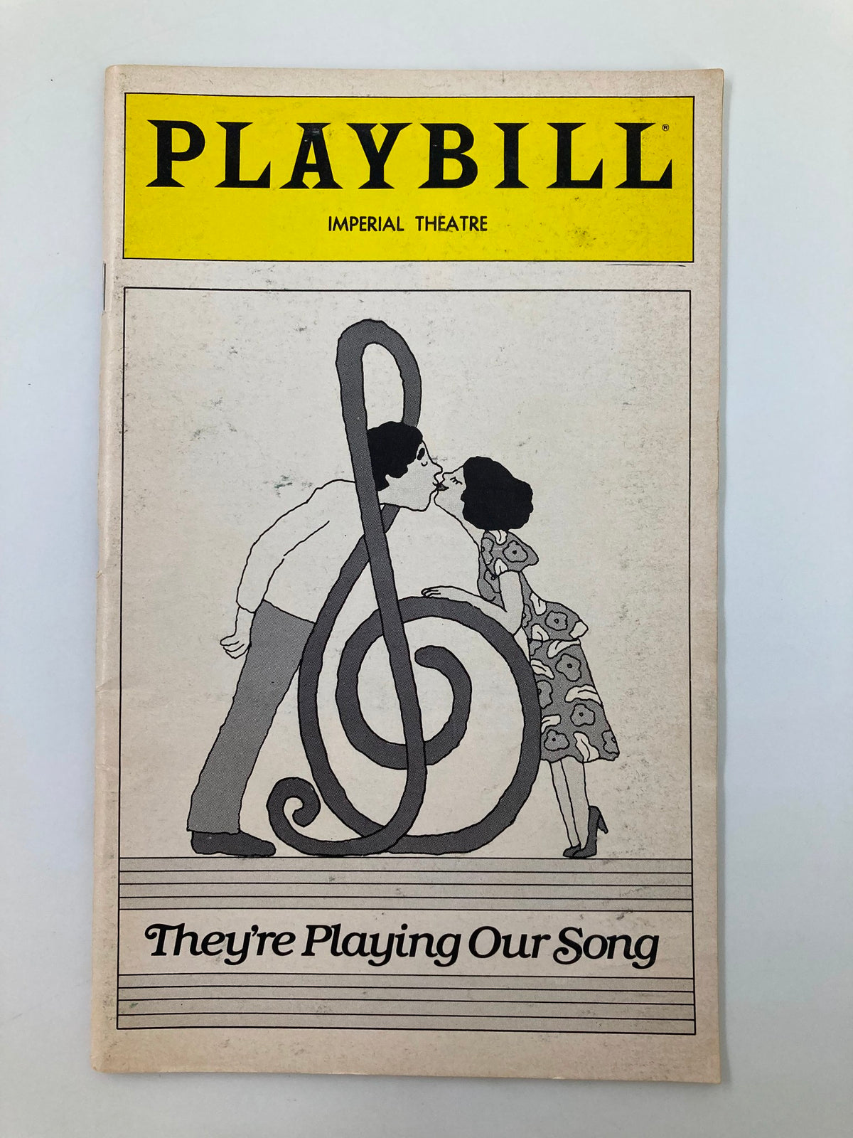 1980 Playbill for 'They're Playing Our Song' at the Imperial Theatre featuring a cover illustration of a couple in front of a treble clef.