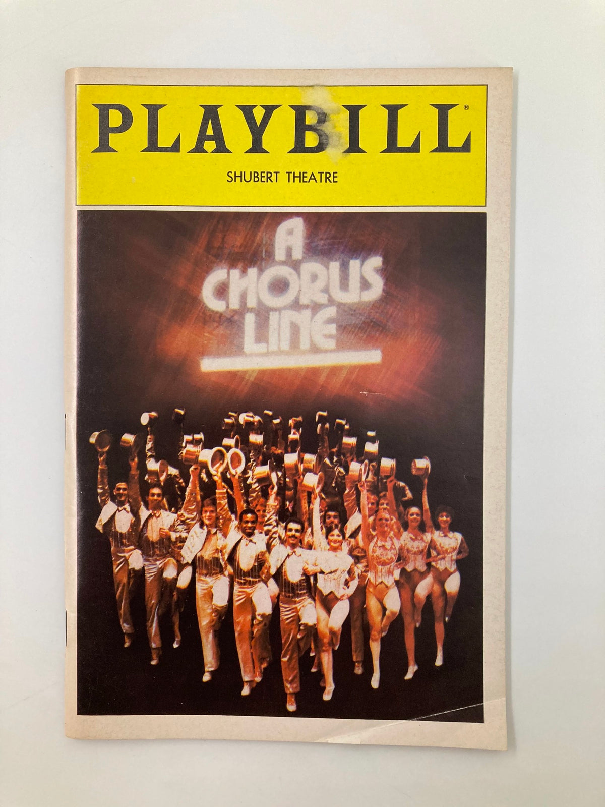 1983 Playbill for A Chorus Line, featuring a vibrant cover image with the title prominently displayed, showcasing the dazzling cast at Shubert Theatre.