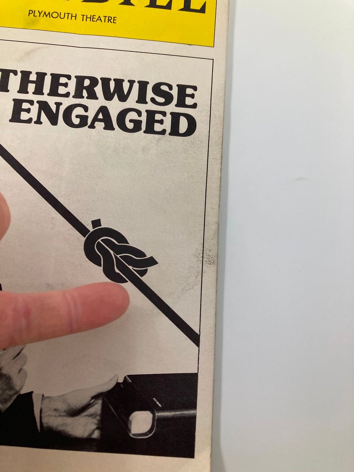 Detailed view of the cover of the 1977 Playbill for 'Otherwise Engaged' at Plymouth Theatre highlighting the unique knot design.
