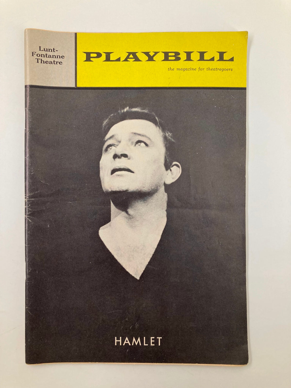1964 Playbill for Hamlet at Lunt-Fontanne Theatre featuring Richard Burton. Cover showcases a dramatic image of the actor looking upwards.
