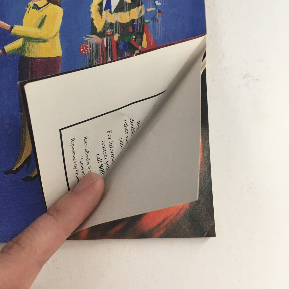 A close-up view of The New Yorker December 16 1991 Full Magazine Theme Cover by Benoit van Innis, highlighting two women, one in a yellow top and the other in a colorful outfit, with fingers pointing at a folded page.