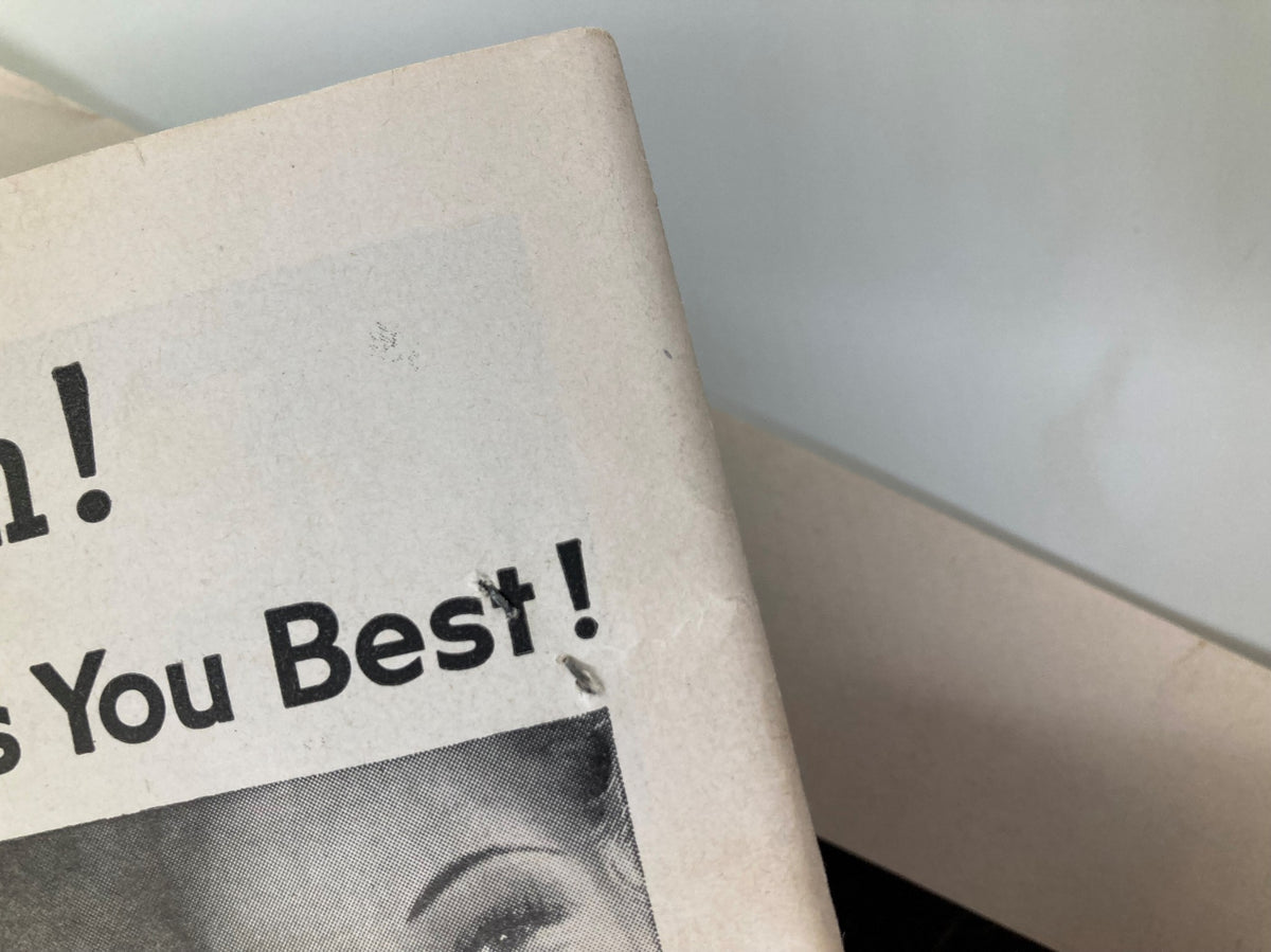 Top edge of the 1957 Playbill from the Winter Garden showing minor wear and a crease on the cover.