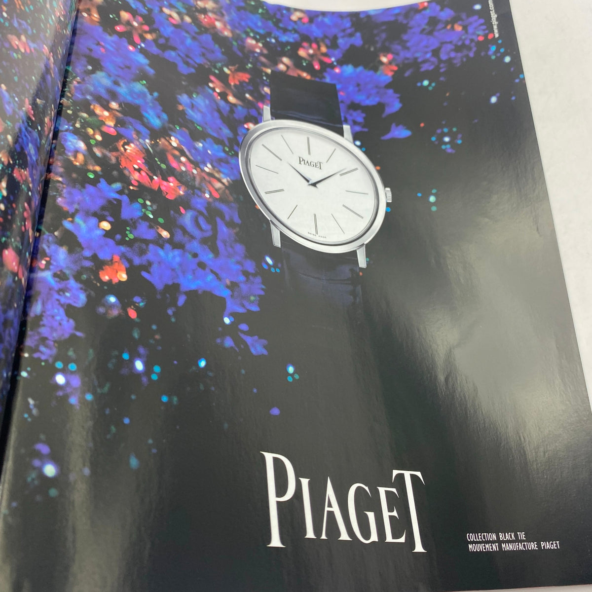 Vogue Paris Supplement December 2005 featuring a Piaget watch against a vibrant floral background, showcasing luxury and style.