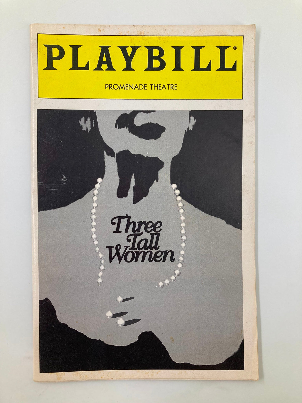 1995 Playbill for The Promenade Theatre's production of Three Tall Women featuring a black and white design with the play's title prominently displayed.