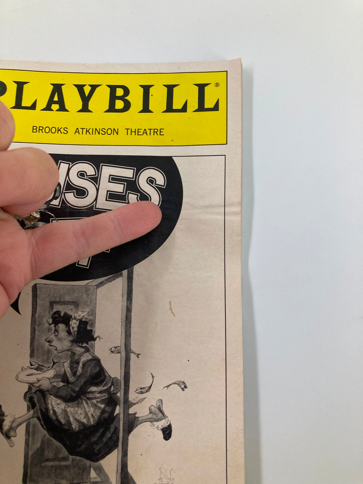 Close-up of the cover of the 2001 Playbill for Noises Off at Brooks Atkinson Theatre highlighting the title and illustration.