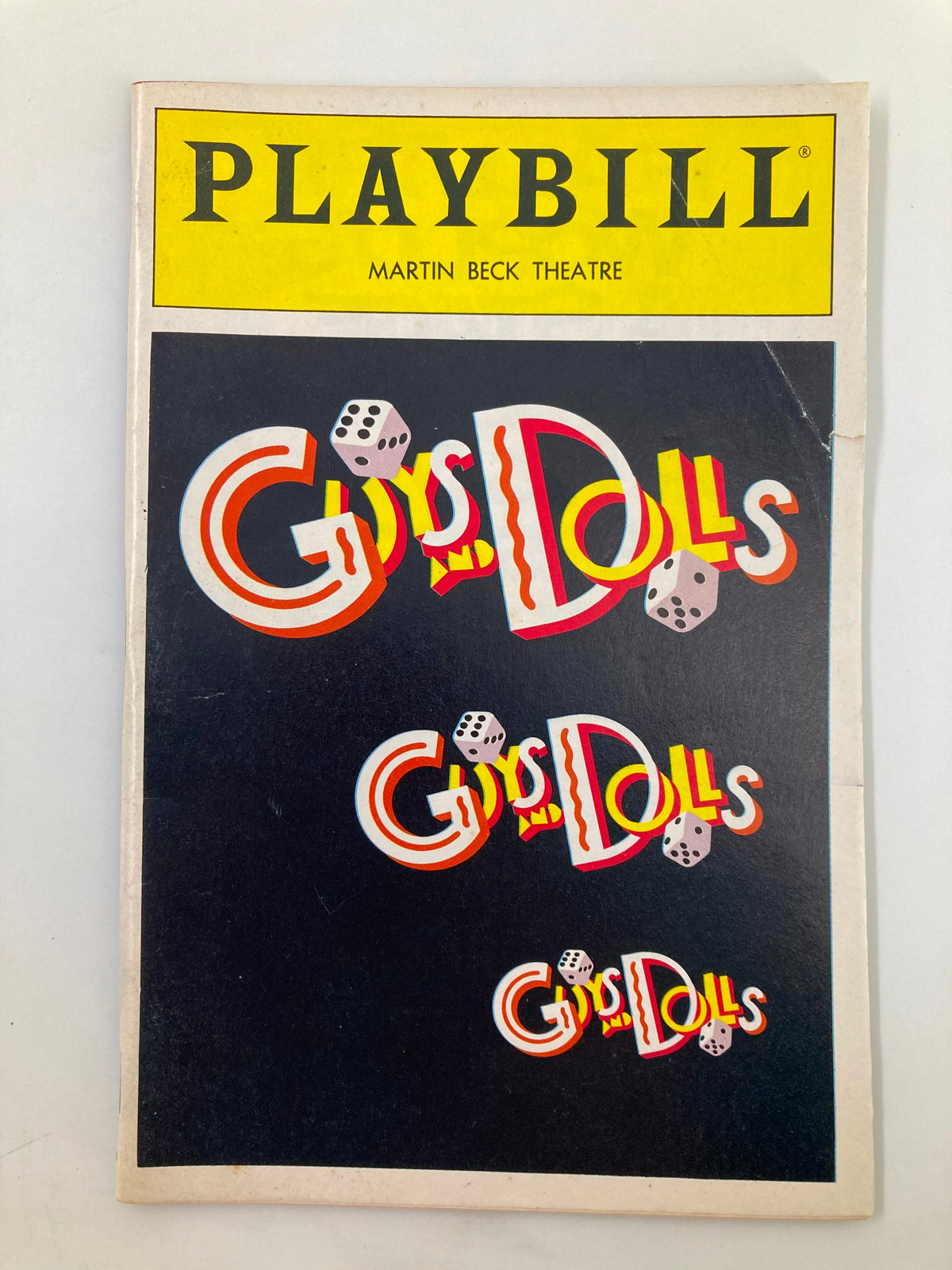 1992 Playbill for 'Guys and Dolls' at Martin Beck Theatre featuring colorful title design with dice visuals, in good condition with minor wear.