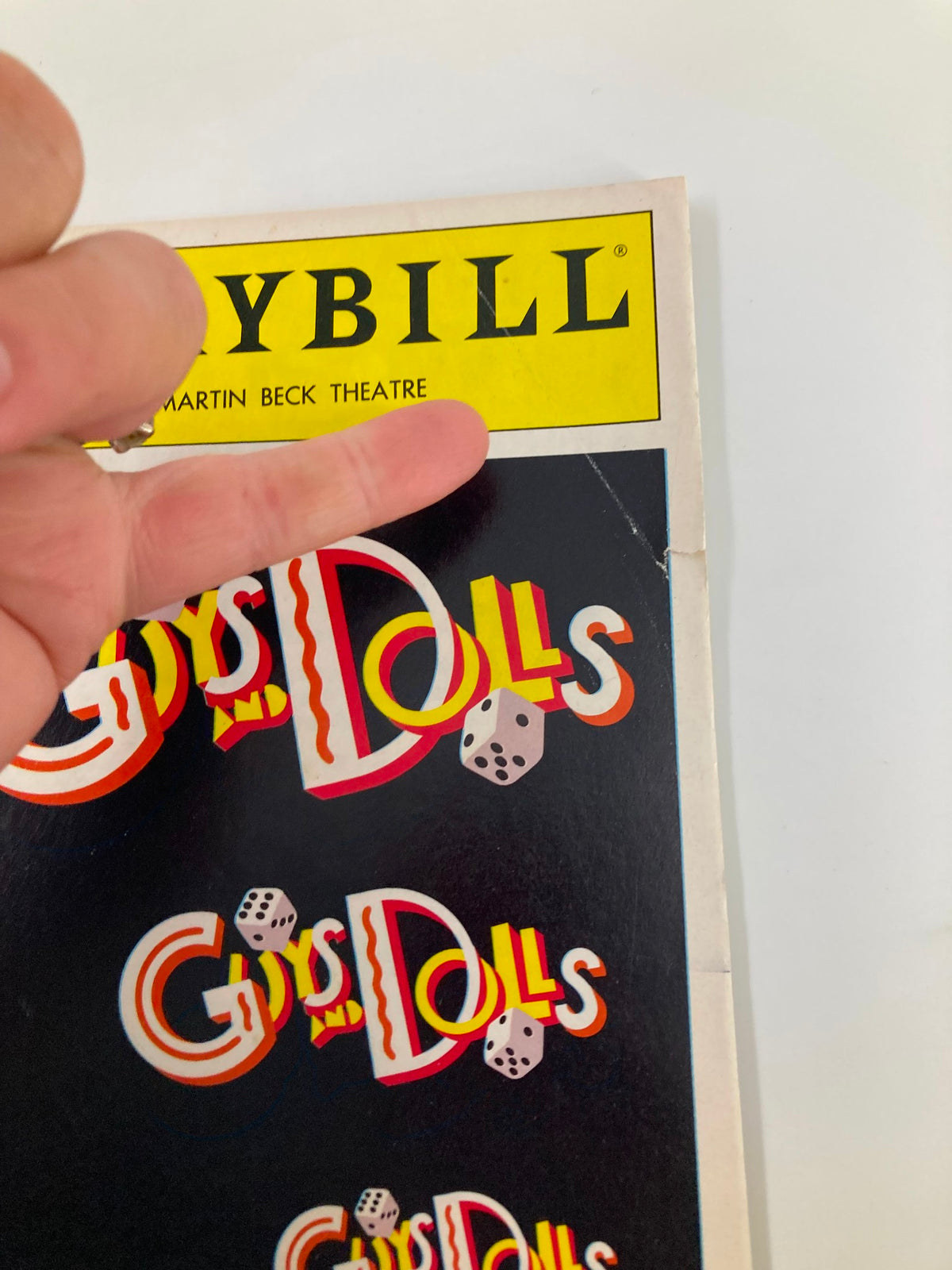 Cover of the 1992 Playbill for 'Guys and Dolls' at the Martin Beck Theatre featuring the title design and logo.