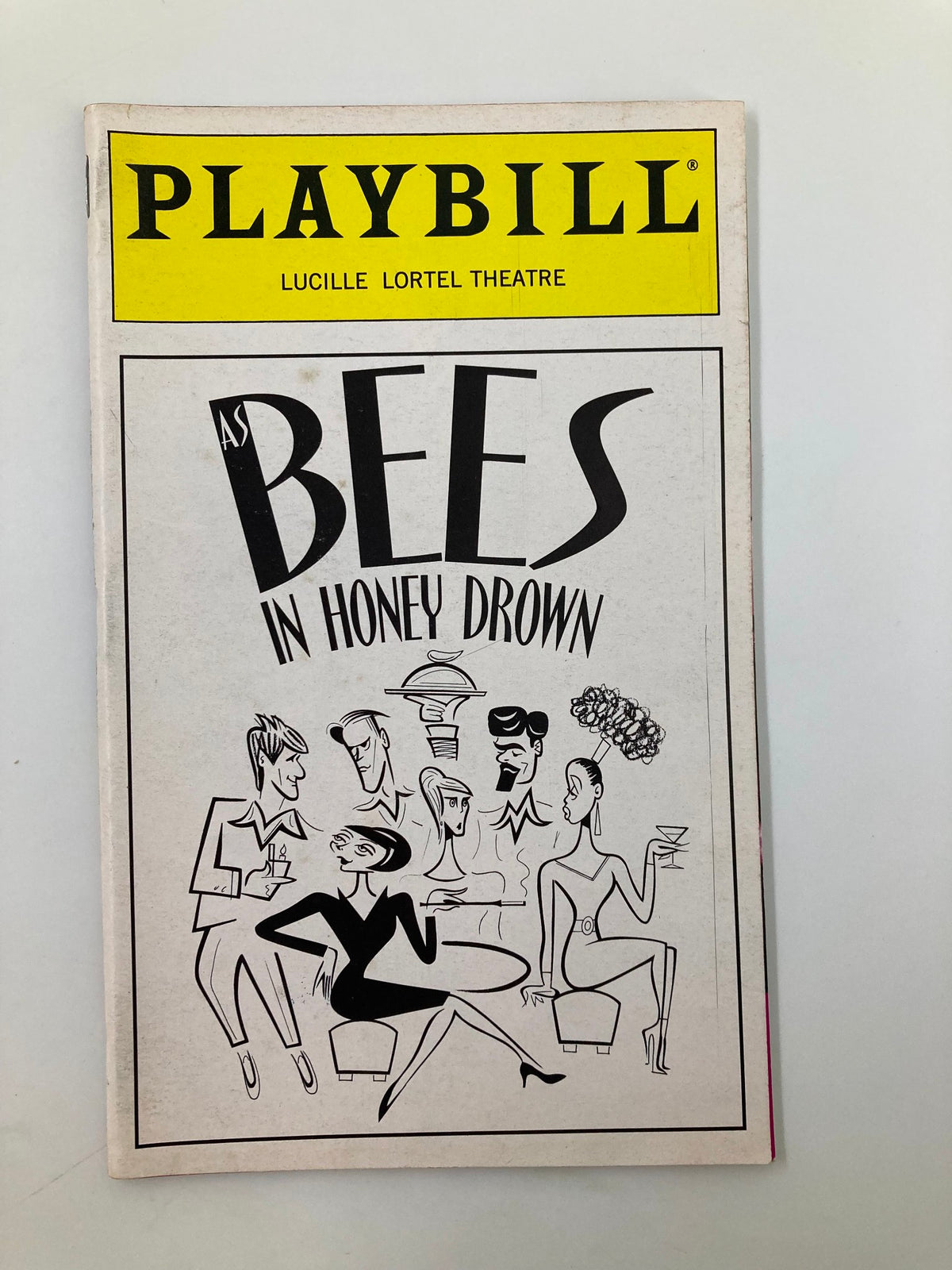 1998 Playbill for the Lucille Lortel Theatre production of 'As Bees In Honey Drown' featuring distinctive caricatures of characters on the cover.