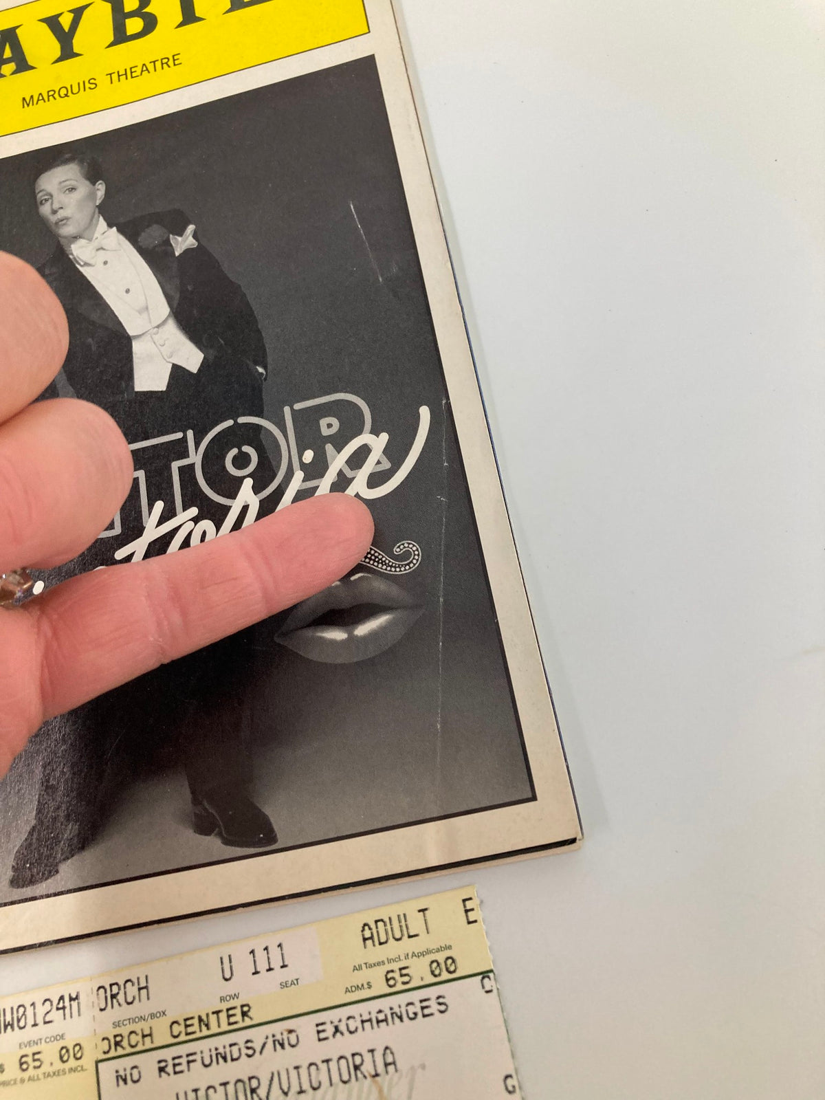 Close-up of the 1996 Victor/Victoria Playbill at Marquis Theatre highlighting Julie Andrews and Tony Roberts, with a ticket visible below.