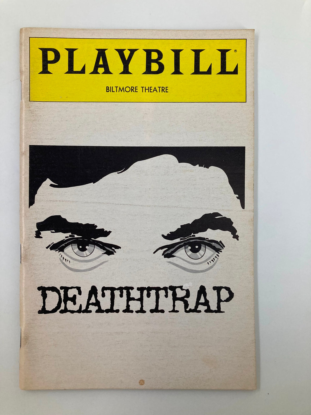 1982 Playbill from Biltmore Theatre featuring the production of Deathtrap with artistic cover design, showcasing dramatic eyes and vintage aesthetics.