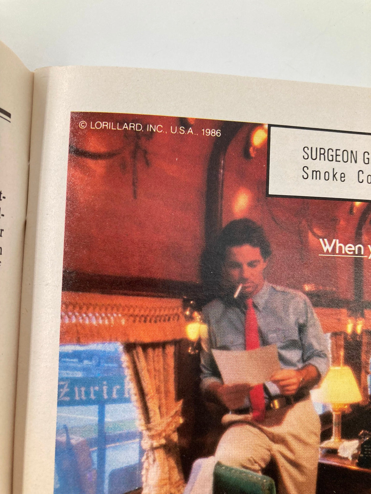 Image from the 1986 New York City Opera South Pacific program showing a man in a vintage setting, holding a script.