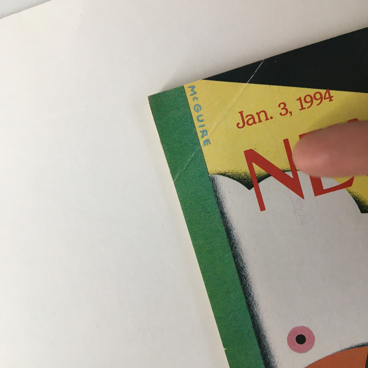 Close-up of the top corner of The New Yorker magazine dated December 27, 1993, featuring the name McGuire and date January 3, 1994, indicating the artist Richard McGuire's cover design.
